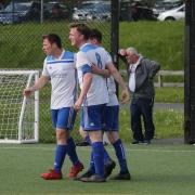 The Magheraveely players celebrate as they win over Omagh Hospitals saw them survive the drop from Division One.