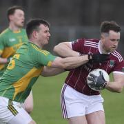 Niall McElroy fends off Tiarnan Daly.