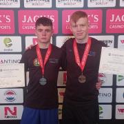 Rhys Owens and Anthony Malanaphy with medals and certifictaes.