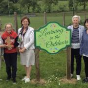 Leila Laporionok, St Joseph’s Primary School Ederney being presented with the School Art Award by Fermanagh Gardening Society President, Mrs. Evelyn Cruwys and Chairman, Mrs Charlotte Gordon also in photograph is FGS Secretary Mrs. Mary Hallett and