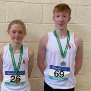 Annabele Morrison and Frank Buchanan with their medals from the Tailteann Games.
