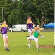 Shane McGullion beats Barry Murray to high ball for Derrygonnellys first goal