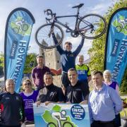 Frankie Reihill holds aloft the bicycle as he is flanked by Mark McCreesh (Cassidy and McCreesh Orthodontic Practice), Damien Teague (Clones Cycliing Club),
Brian McCabe (Lisnaskea Emmetts), Caroline Ferguson (Action Mental Health), Colin Maguire