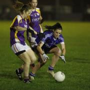 Aine McGovern stoops to get the ball ahead of Imelda Jones.