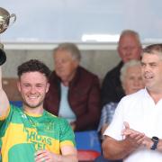 Irvinestown captain Kevin McDonnell lifts the cup after their win over Belcoo in the Division Two final today.