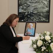 Deobrah Erskine, DUP, MLA, signing the book of condolences for Her Majesty Queen Elizabeth II, in Enniskillen Townhall.