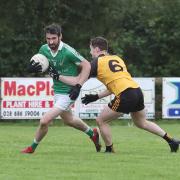Niall Cosgrove is tackled by Jack McCann