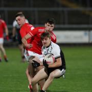 Eoghan McCabe breaks free from the challenge of Sean Conlon