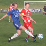 Enniskillen Rangers captain Stuart Rainey is tackled by Athletic’s Conor McAloon.