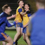 Ciaran Smith in congratulated by Conor Love after his penalty sent Enniskillen through against Gowna at Brewster Park tonight.