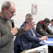 Reggie Ferguson (left), Chair, Save Our Acute Services, speaking at a previous public meeting in the Lakeland Forum.