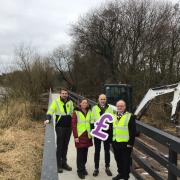 Mark Leavey (the Council's Capital Projects Manager), Colleen Convie (project manager), John News (Director of Environment and Place) and Councillor Barry McElduff (Chair of the Council) at Killyfole Lough.