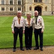 Pictured from left are George Irvine MBE, Rosemary Forde and Maurice Lee MBE at Windsor Castle.