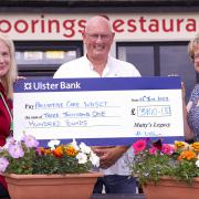 Hilda Watson, (right), presenting a cheque to Vivien Gibbons, Macmillan Nurse Specialist, on behalf of Palliative Care WHSCT. Also included is Charlie Oldcroft, Moorings Restaurant.