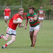 James Connolly braces for the challenge from Niall Keenan.