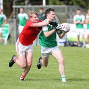 Adam Callaghan comes under pressure from Ruaidhri O'Keefe