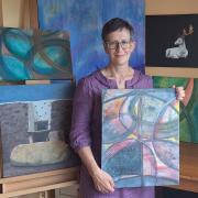 Artist Morag Donald pictured with a number of her pieces.
