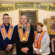 Kenneth Rutledge, Chaplain of LOL 1333; Mervyn Byers, County Grand Master; and Beverley Elliott, District Chaplin of WLOL District 2, launching the Banner Mission, which will begin this weekend.