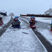 Cara, Cian, Lorcan and Finn McAloon who sled their way to school in Maguiresbridge on Friday morning.