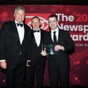 Rodney Edwards (right) accepting the UK Weekly Newspaper of the Year 2024  on behalf of The Impartial Reporter.