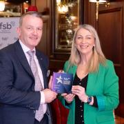 Roisin McAliskey, Development Manager from the Federation of Small Businesses, presenting the Northern Ireland Community award to David Donaldson, from LE Graphics, Enniskillen.