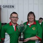 Local bowlers Ronnie Stubbs (left) and Esther Forster (second right) with their unbeaten Rink that helped Ireland to the title.
