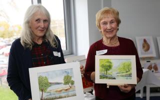 Mary-Anne Grant and Moyra Tapster display their watercolour prints.