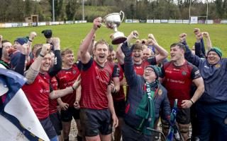 Clogher Valley captain, Paul Armstrong, lifts the AIL 2C trophy.