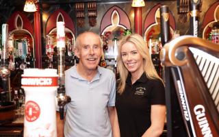 Gerry Burns, celebrating 40 years, pictured with his daughter Una, manager of Charlie's Bar.